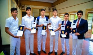 Lionsmen with medals at Trinity College Kandy